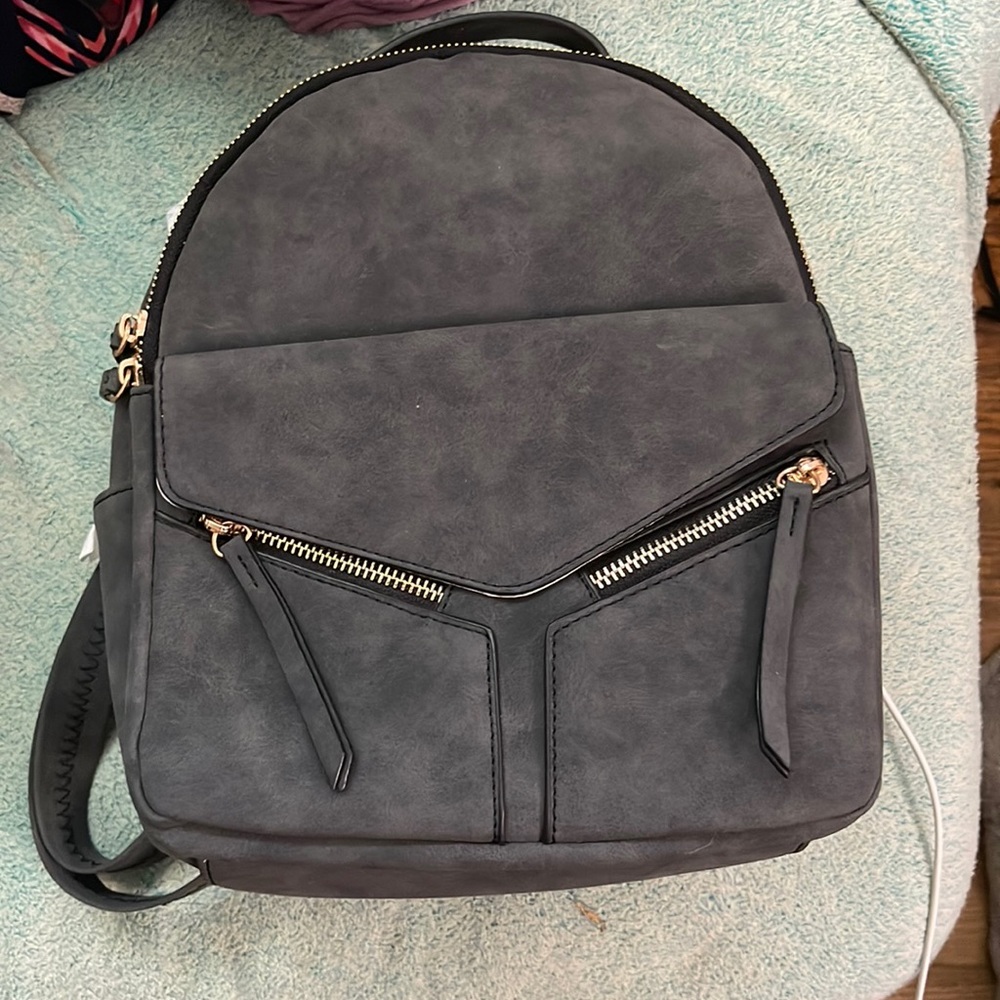 Black VR brand mini backpack.
